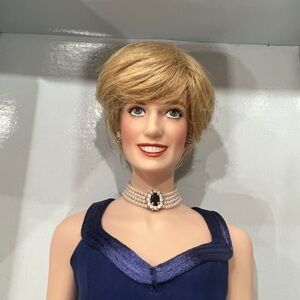Franklin Mint Princess Diana porcelain doll with accessories in original box.